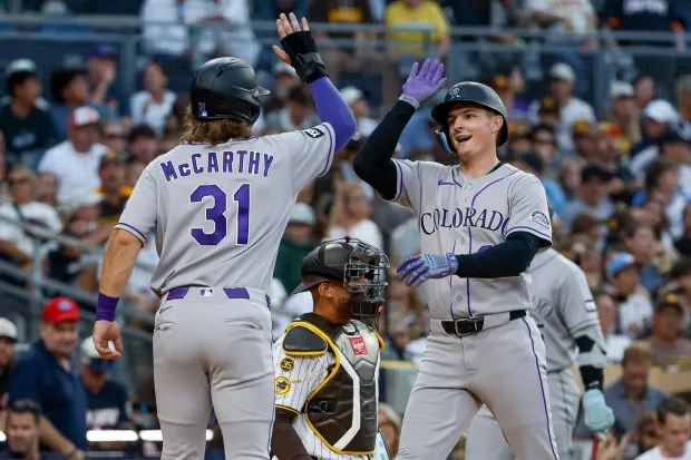 Jake McCarthy and Mickey Moniak of the Colorado Rockies celebrate after Moniak's home run during the third inning at Petco Park on Tuesday's game at Petco Park. (Meg McLaughlin / The San Diego Union-Tribune)