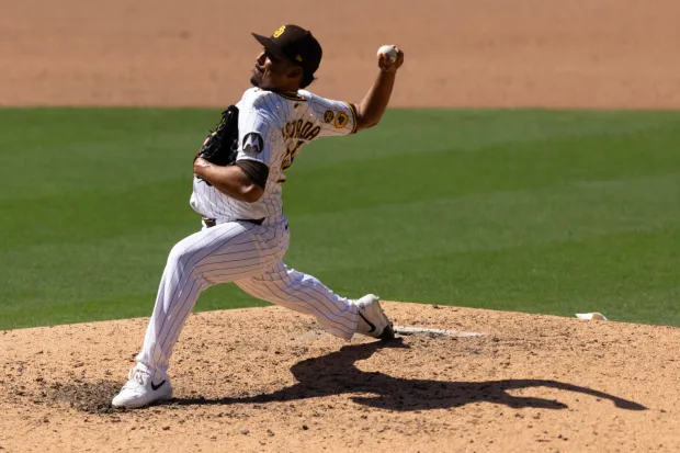 Padres relief pitcher Jeremiah Estrada throws during Wednesday's game against the Colorado Rockies at Petco Park. (Luke Johnson / The San Diego Union-Tribune)