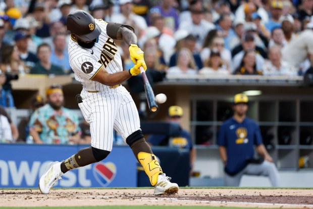 Luis Rengifo #21 of the San Diego Padres hits a grand slam against the Milwaukee Brewers during the second inning at Petco Park on Tuesday, Aug. 11, 2026 in San Diego, California. (Meg McLaughlin / The San Diego Union-Tribune)