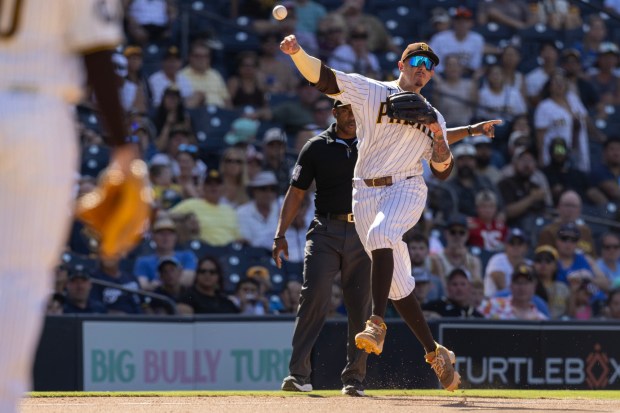 San Diego, CA - San Diego Padres third baseman Manny Machado, No. 13, makes a play during a game against the Milwaukee Brewers Wednesday, Aug. 12, 2026, at Petco Park in San Diego, CA. The runner was safe at first. (Luke Johnson / The San Diego Union-Tribune)