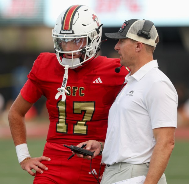SOLANA BEACH, CA - August 21, 2026: Santa Fe Christian's quarterback Dax Labrum talks to quarterback coach and former NFL quarterback Drew Brees during the fourth quarter against Helix at the Santa Fe Christian School in Solana Beach on Friday, August 21, 2026. (Hayne Palmour IV / For The San Diego Union-Tribune)