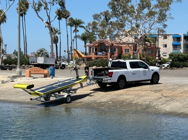 Researchers from Cal State Long Beach place their new shark surveillance bot into the water near Long Beach, Calif. in July 2026. (Photo: CSULB / Chris Lowe)