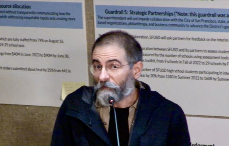 Man with mustache at microphone