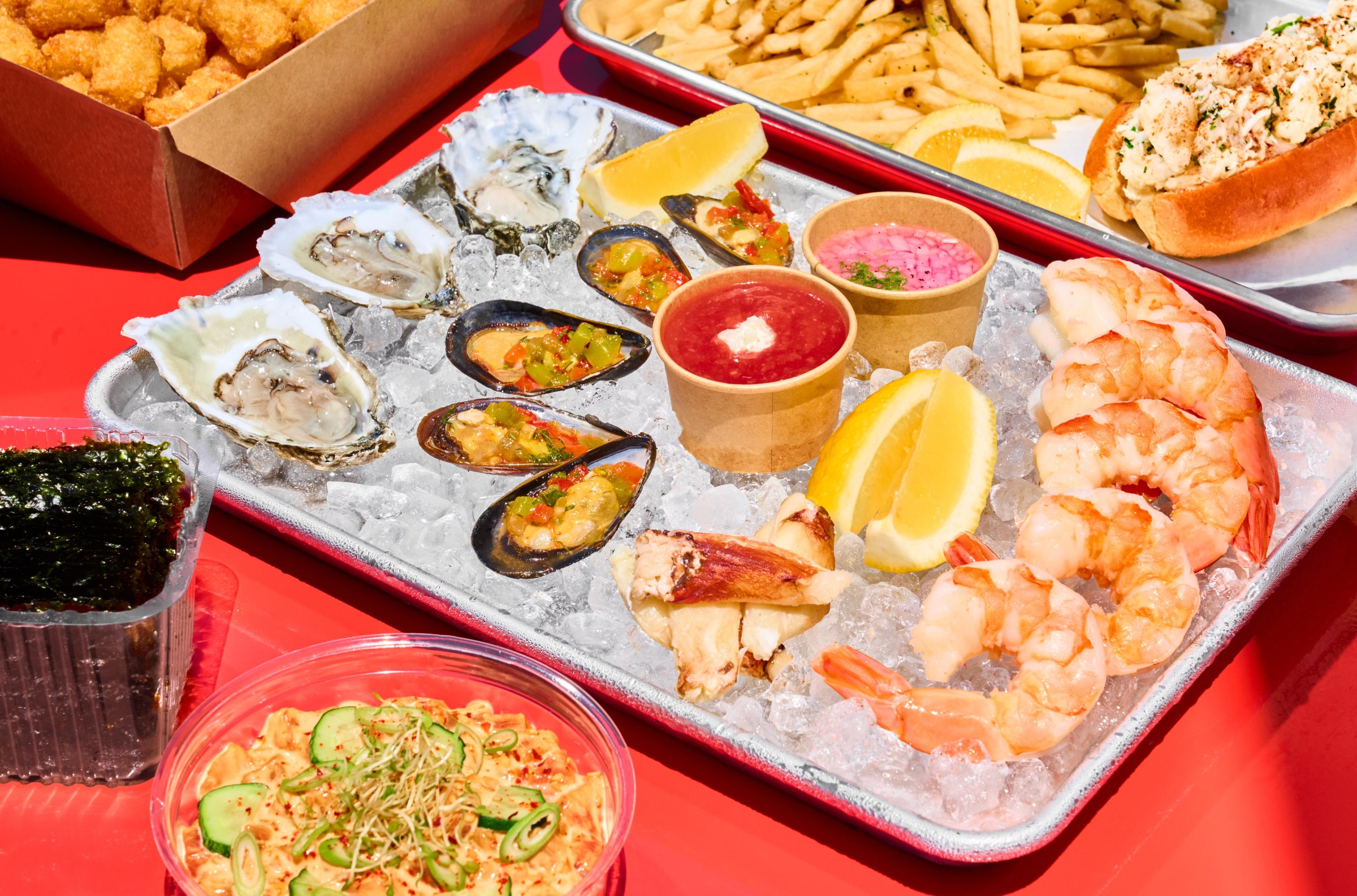 A tray of seafood, with oysters, mussels, crab, and poached shrimp over ice at the Mess Hall in San Francisco.