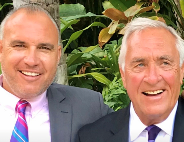 two men dress in suits
