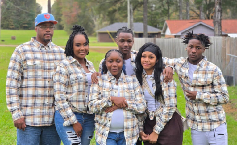 Victoria poses for a family portrait with her husband and four children