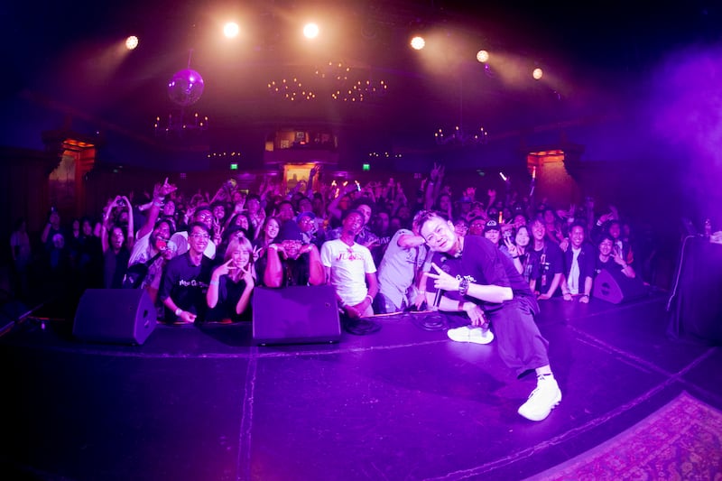 Artist takes photo with audience