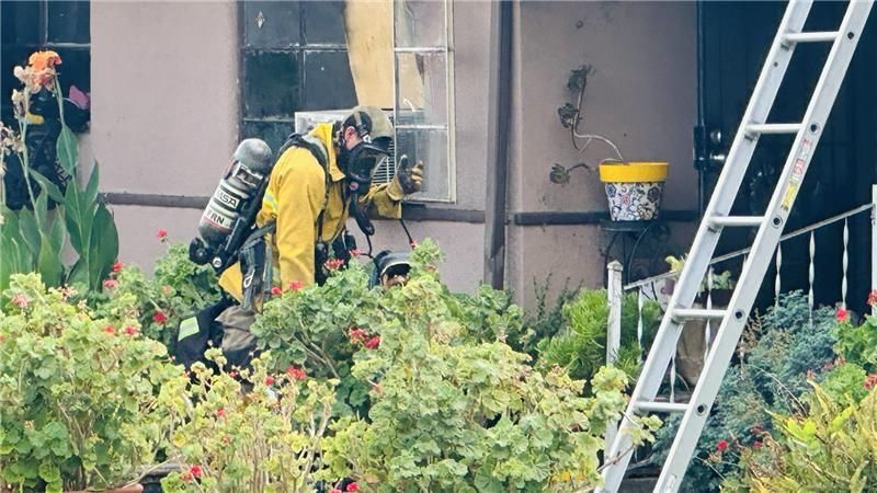 A Fresno home shows damage after a fire broke out Thursday afternoon near Palm and Shields avenues. (PHOTO: Courtesy FOX26 Photojournalist John Dwelle)