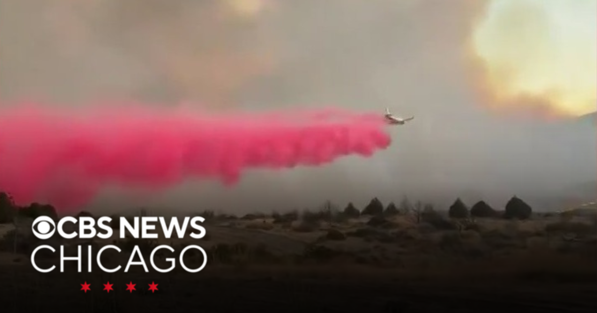 Firefighters work to contain intense fire near California-Nevada border