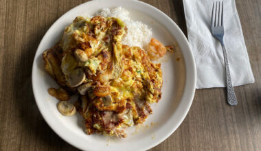 Chinese-style scrambled eggs with shrimp over rice.