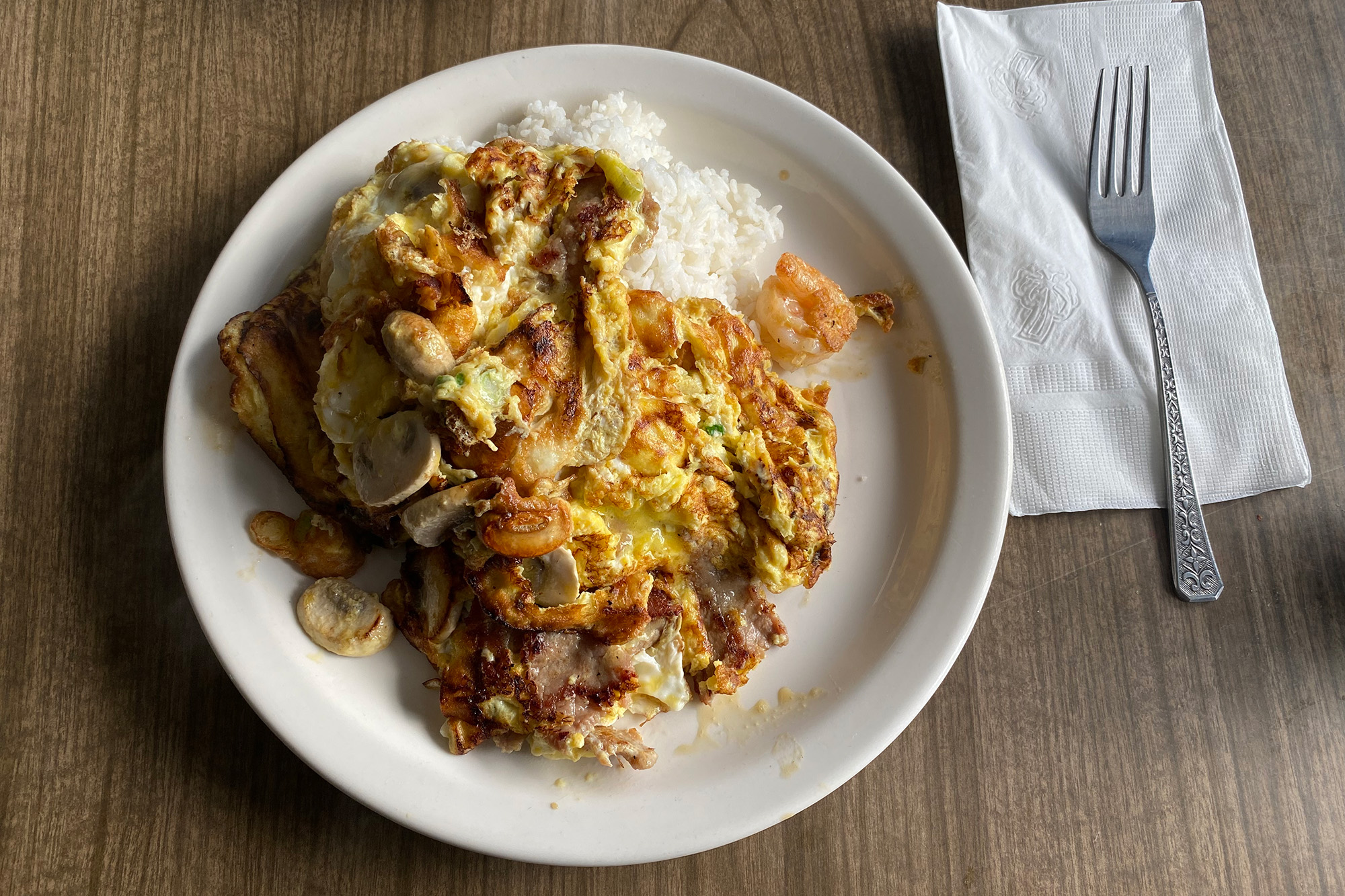 Chinese-style scrambled eggs with shrimp over rice.