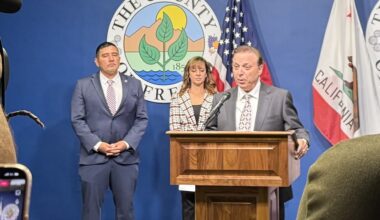 man speaking at news conference