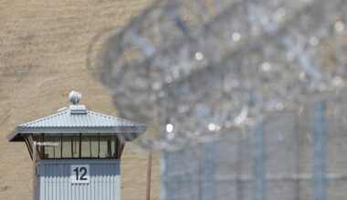 FILE - A guard tower and razor wire are seen at California State Prison, Solano in Vacaville, Calif. on Wednesday May 20, 2015. The overcrowded California prison was running on emergency generator power for a third day Tuesday, July 16, 2024, following a major electrical outage in the area over the weekend amid a heat wave. (AP Photo/Rich Pedroncelli, File)
