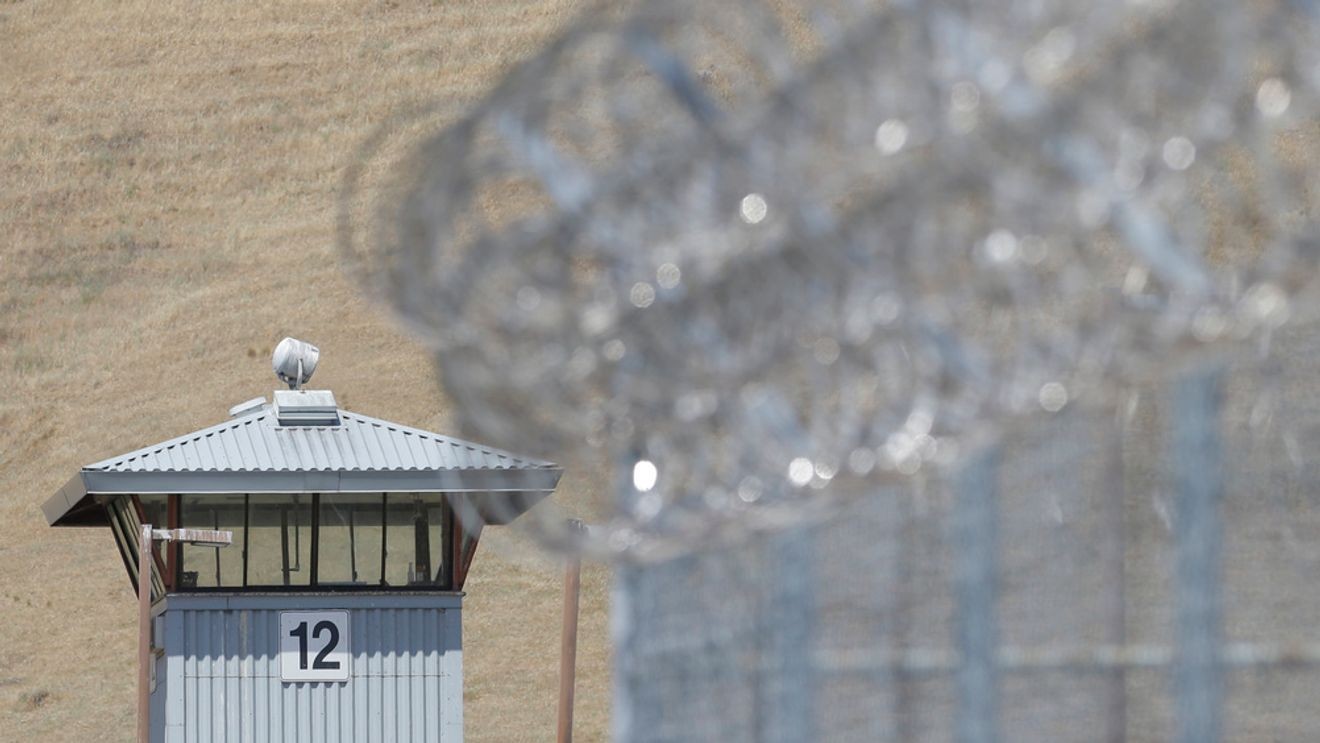 FILE - A guard tower and razor wire are seen at California State Prison, Solano in Vacaville, Calif. on Wednesday May 20, 2015. The overcrowded California prison was running on emergency generator power for a third day Tuesday, July 16, 2024, following a major electrical outage in the area over the weekend amid a heat wave. (AP Photo/Rich Pedroncelli, File)