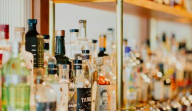 Close up of a shelf of alcohol bottles