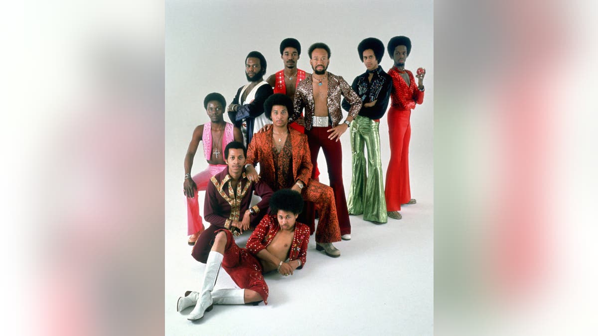 Earth Wind & Fire posing for a studio portrait.