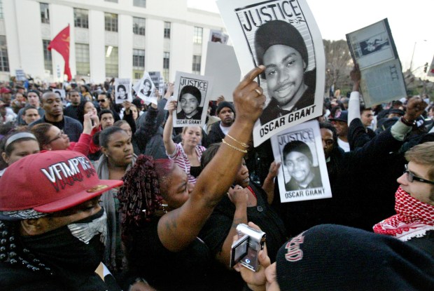 Protesters shout their message outside the Alameda County District Attorney's office during a rally in protest of the killing of Oscar Grant III in downtown Oakland, Calif., on Wednesday, January 14, 2009. (Anda Chu/Staff)