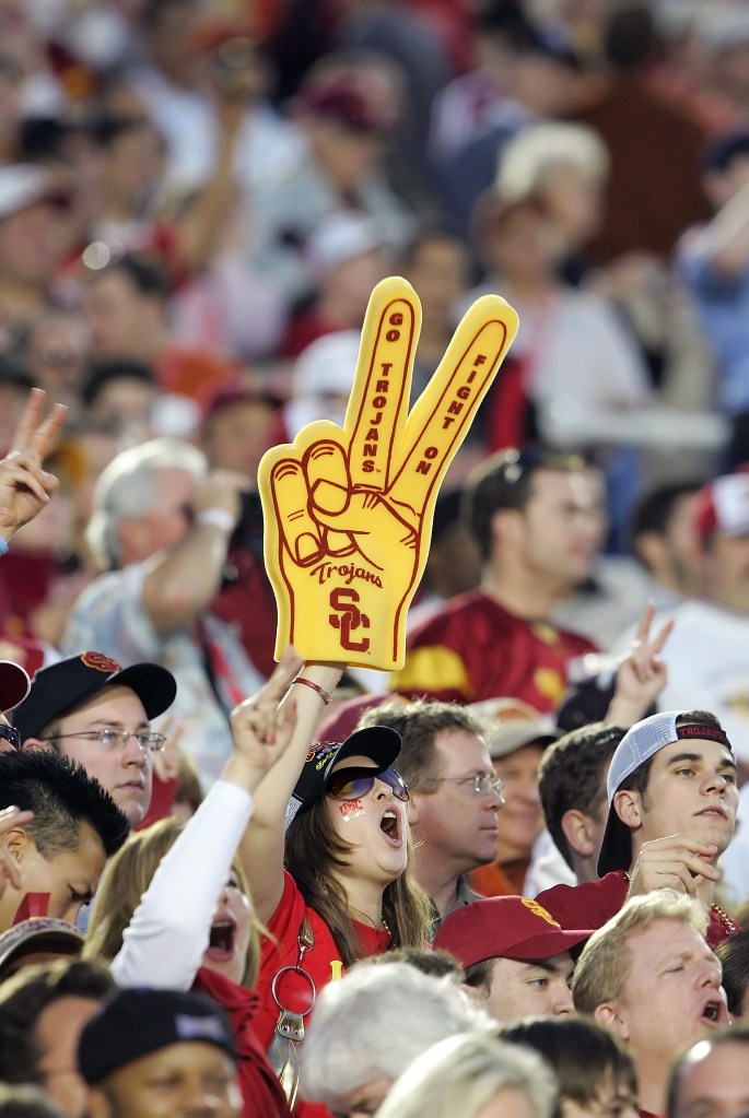Fans of the USC Trojans cheer in the stands before the start of the BCS National Championship