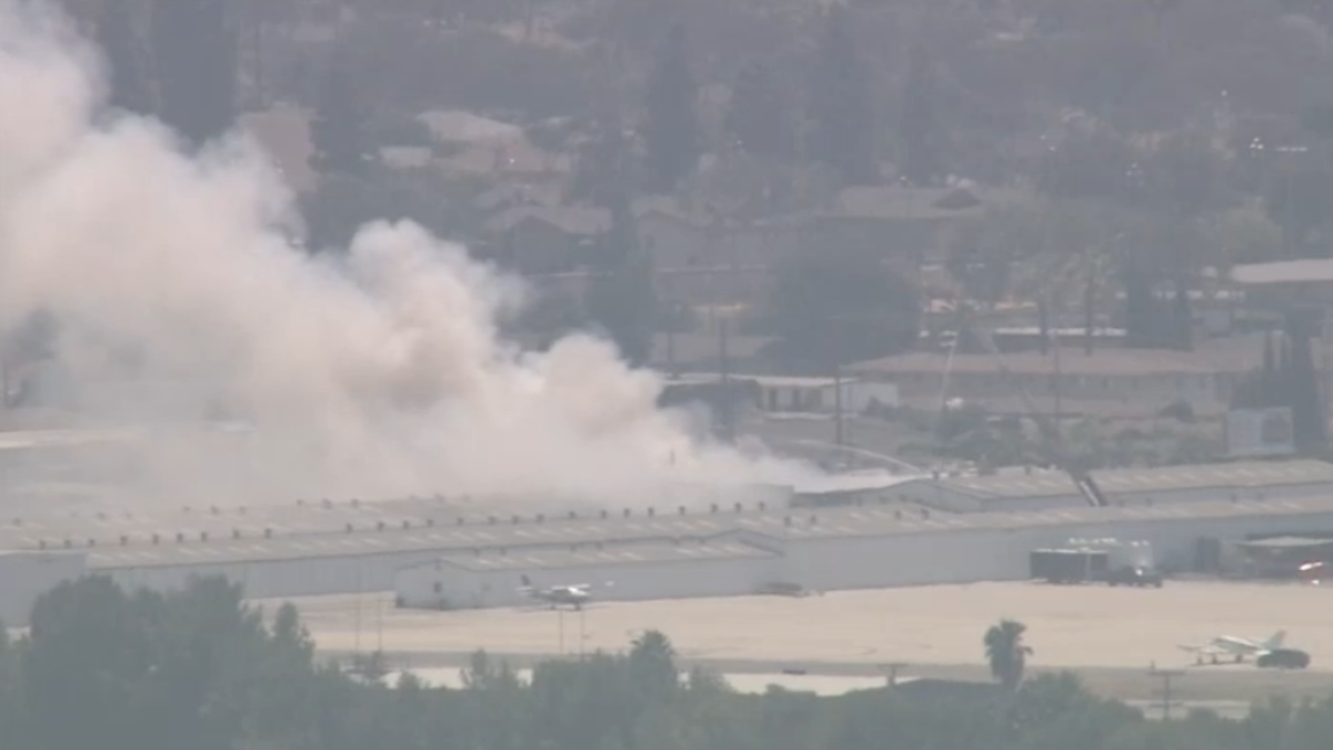 Fire burns at warehouse near Fullerton Municipal Airport – NBC Los Angeles