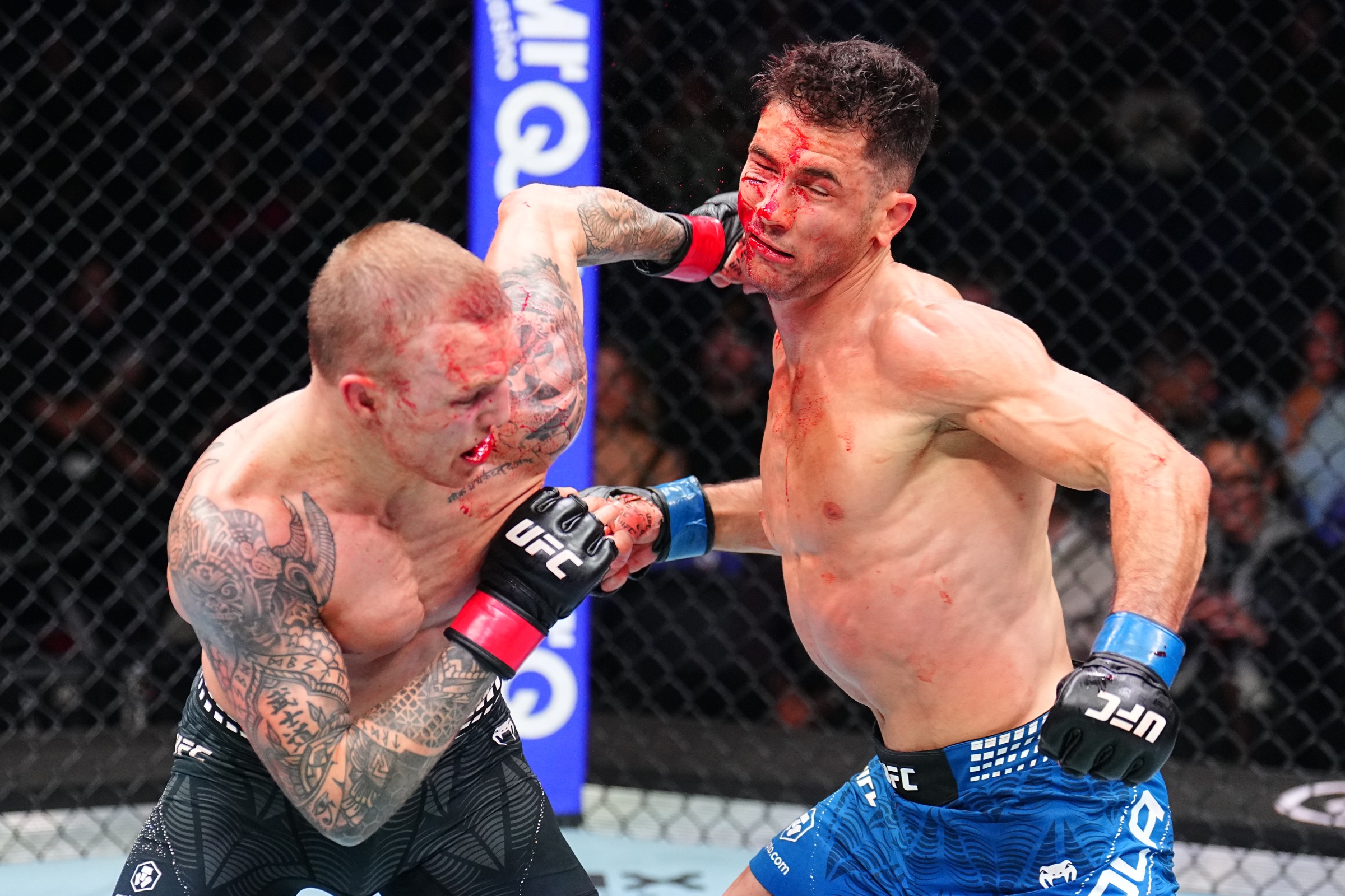 LONDON, ENGLAND - MARCH 21: (L-R) Mason Jones of Wales punches Axel Sola of France in a lightweight fight during the UFC Fight Night event at The O2 on March 21, 2026 in London, England. (Photo by Chris Unger/Zuffa LLC)