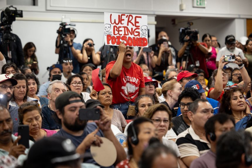 A protester reacts as Los Angeles Mayor Karen Bass delivers a speech during a meeting about recovery efforts from the eight-day fire at Lineage's cold-storage warehouse in Boyle Heights on Thursday, July 9, 2026.