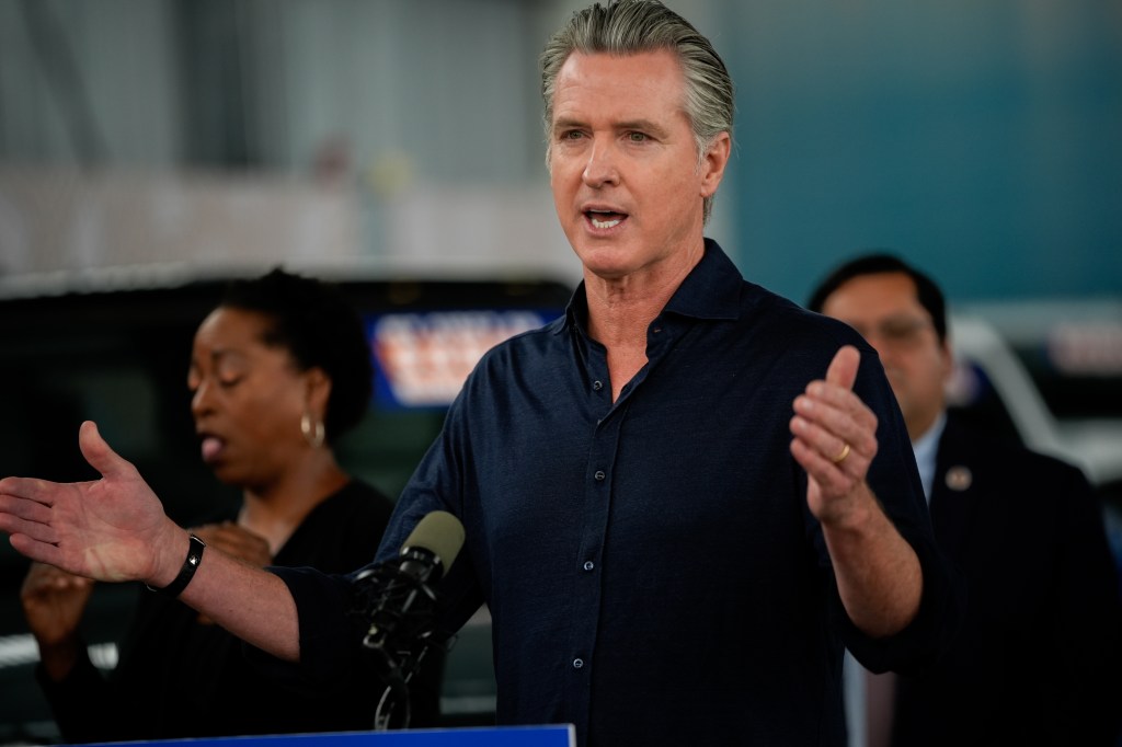 Governor Gavin Newsom speaking at a press conference in Oakland, California, about clean energy.