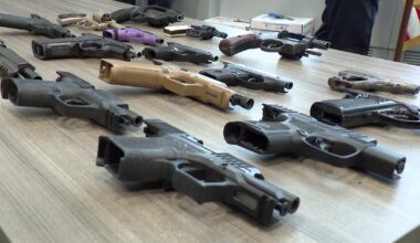 Numerous guns, drugs and thousands in cash found at Long Beach home, police say