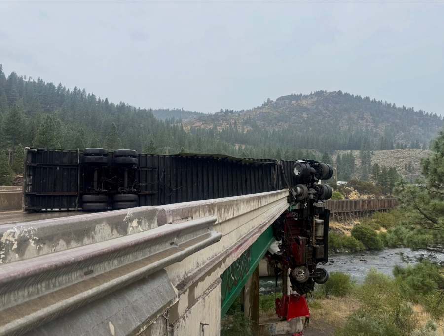Major-injury crash leaves big rig dangling from bridge on California interstate