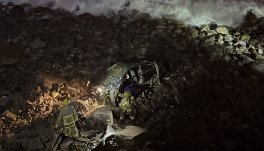 Driver survives crash down coastal California cliffside