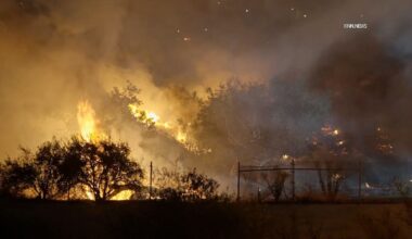 Brush fire threatens homes and school in Southern California