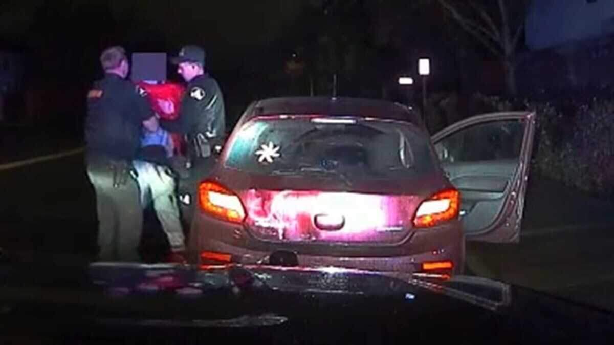 Sacramento County sheriff’s deputies pull Tywain Lamale Smith from a car during a Feb. 16 traffic stop near Elk Grove Florin Road and Tiogawoods Drive in an image taken from an in-car camera. Deputies had spotted a handgun on Smith’s right hip, according to the Sheriff’s Office. Smith broke free moments later and ran before deputies shot him.