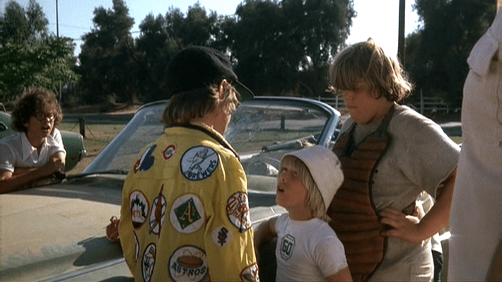 Ogilvie (Alfred Lutter), left center, confronts Tanner Boyle (Chris Barnes), right center