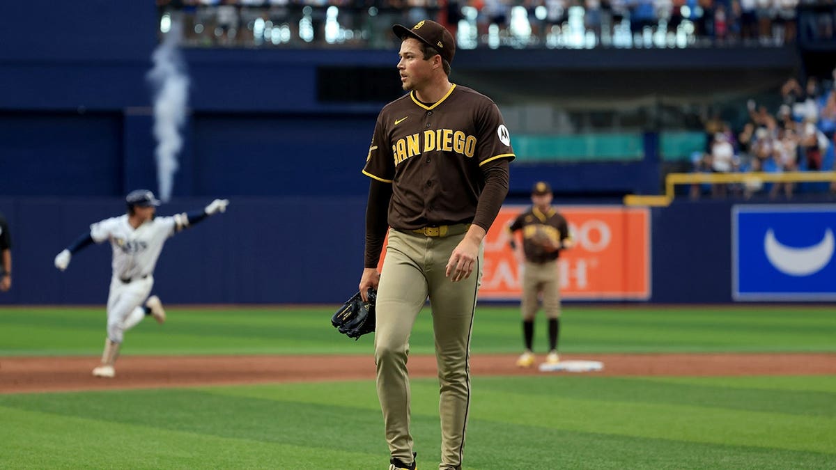 Mason Miller reacts as Jonny DeLuca hits a home run at Tropicana Field.