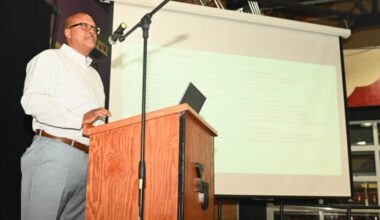 Port Commissioner and Maritime Attorney Derrick Muhammad delivers a speech at Youth Uprising in East Oakland on Saturday, July 25. Photo by Graig Brooks.