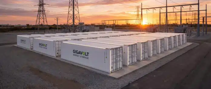 Grid-scale sodium-ion battery energy storage facility with containerized units at sunset