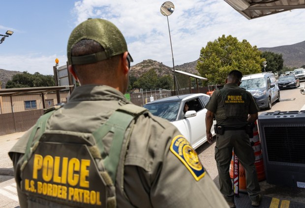 Jamul, CA - US Border Patrol officers conduct stops at the Highway 94 United States Border Patrol Checkpoint on Friday, July 17, 2026, in Jamul, CA. (Luke Johnson / The San Diego Union-Tribune)