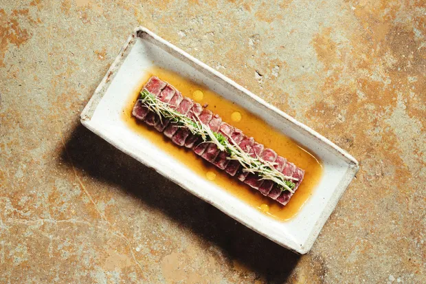 Wagyu tataki with daikon sprouts at Zuma, the London-born contemporary Japanese restaurant chain opening its first West Coast location Aug. 10 at San Diego's Guild Hotel. (Boston roasted lobster) from the Japanese restaurant Zuma. (Rusne Draz)