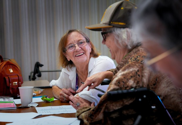 Susan Strauel (l), 69, and Laura Morgan (r), 72, interact during a writing workshop at Father Joe's Villages on Monday, Aug. 17, 2026, in San Diego, CA.  Every Monday, adults who have become homeless or formerly homeless participate in a creative writing workshop where they write poems, memoirs, and short plays.  (Nelvin C. Cepeda / The San Diego Union-Tribune)