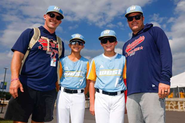 Sweetwater Valley's Zachary Patterson and his stepson Asher Giglio #3, and James Griffin #12, and his father James Griffin pose for a photo outside Volunteer Stadium on Saturday, Aug. 22, 2026 in South Williamsport, Pennsylvania. (Meg McLaughlin / The San Diego Union-Tribune)