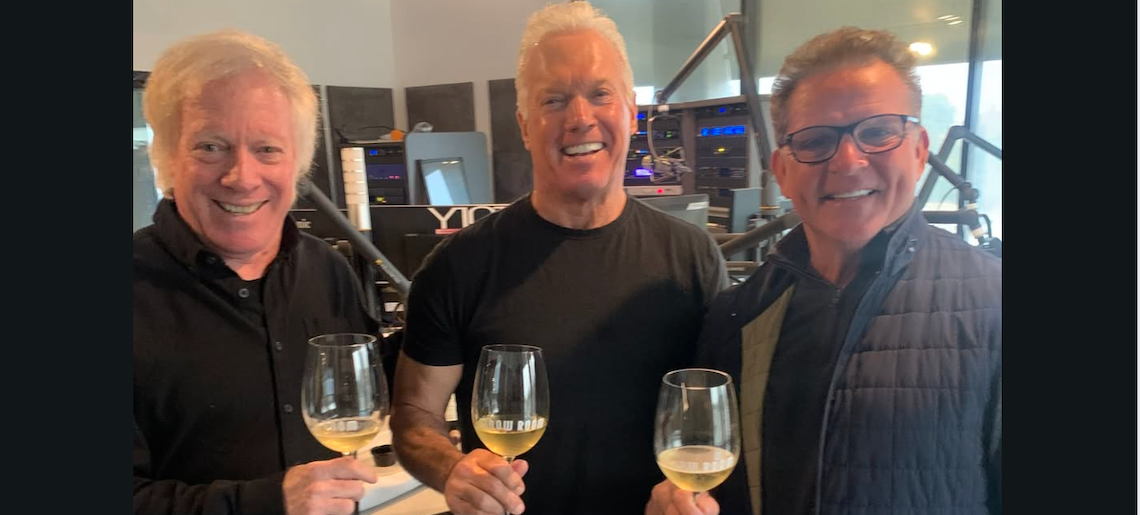 three men toasting with wine