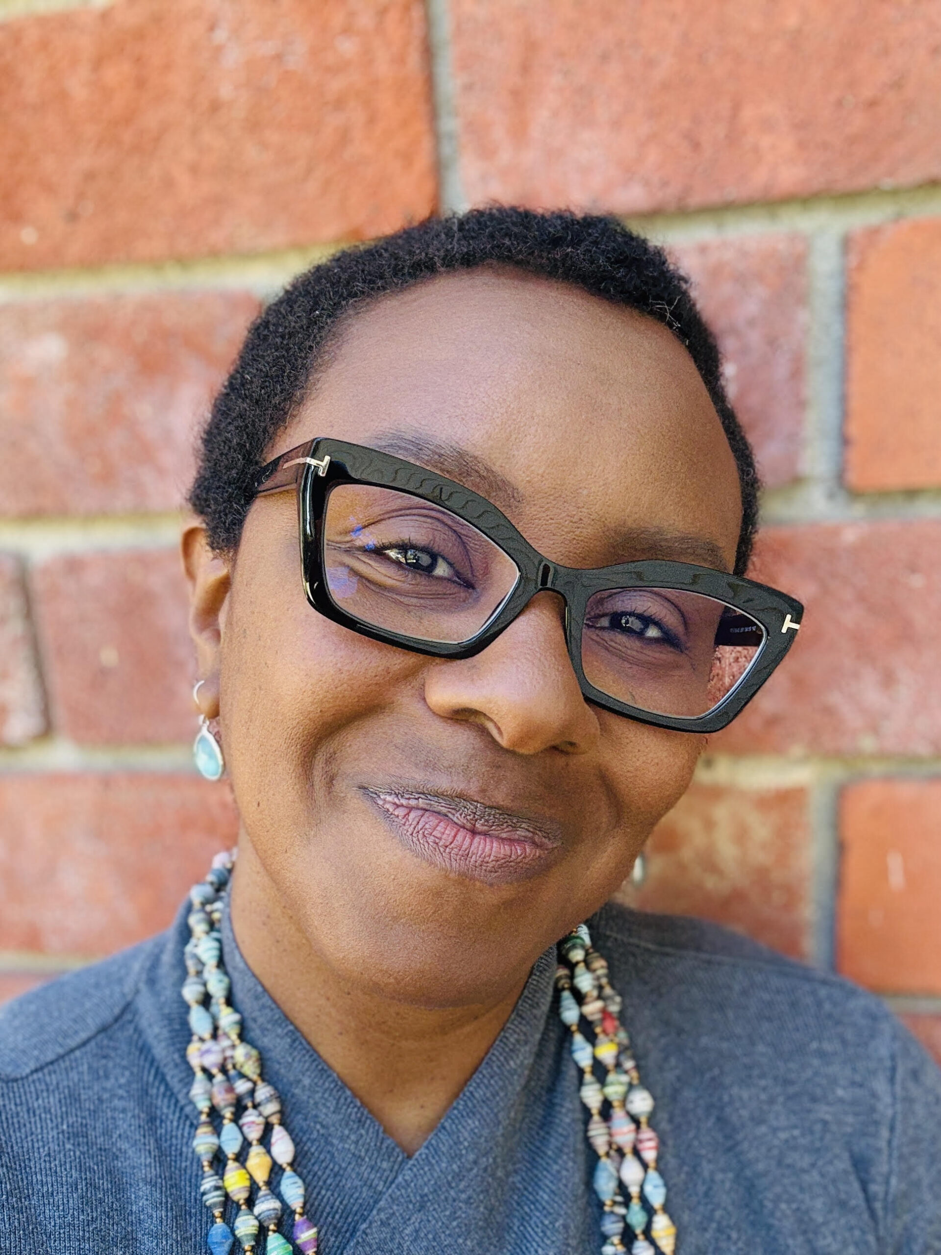 smiling woman in glasses
