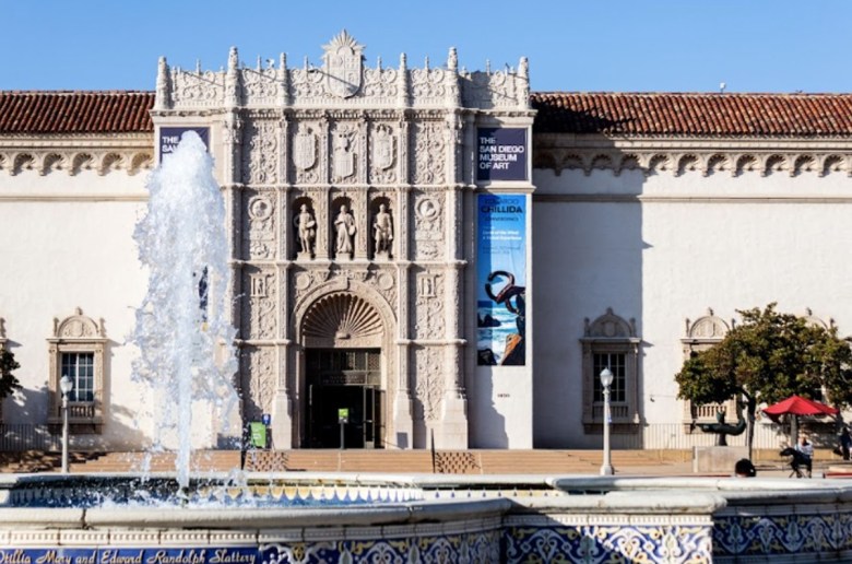 The Spanish Renaissance architecture is a feature of the San Diego Museum of Art, where a fountain on the plaza shoots up water on a bright day.