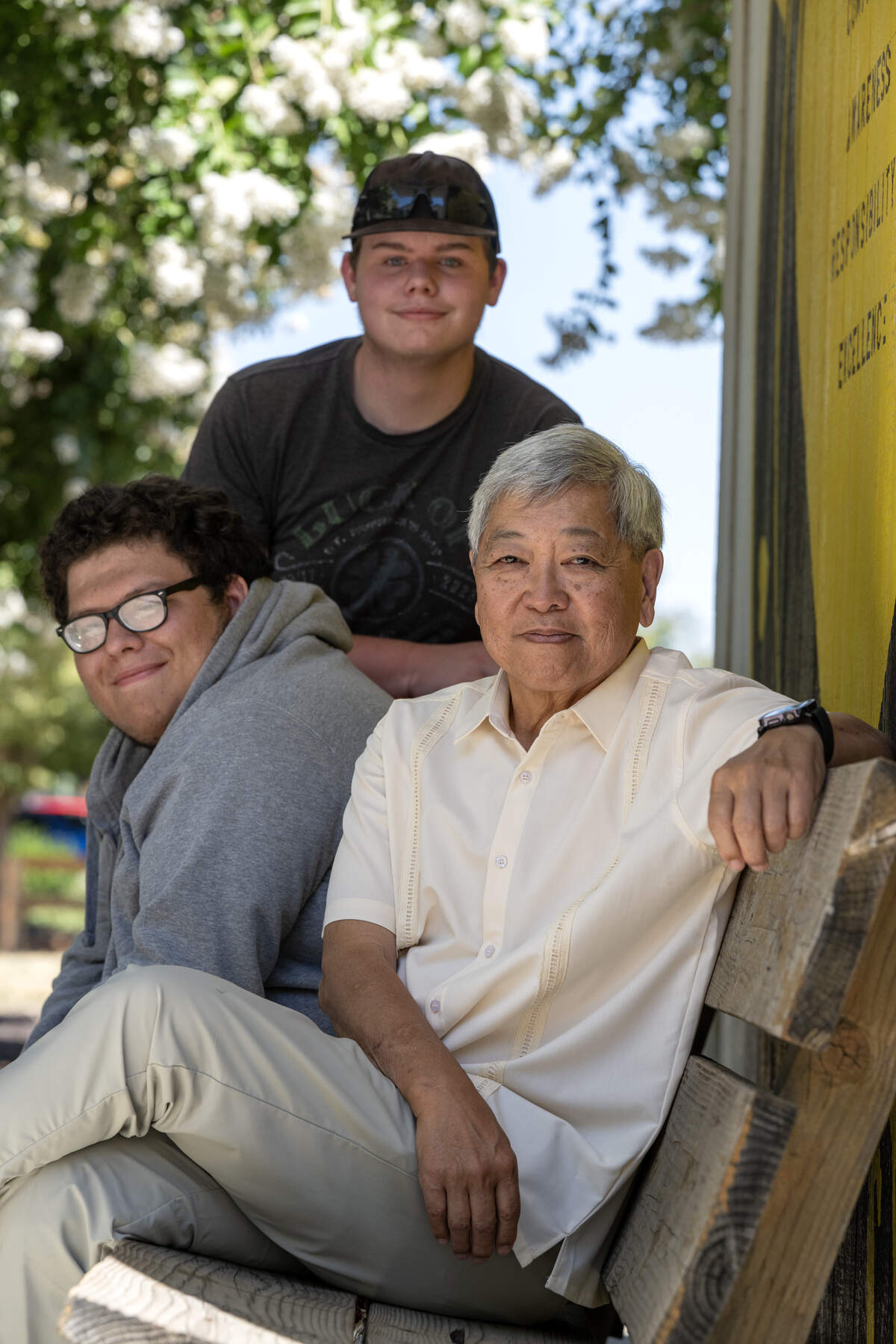 Shelton Yip, an educator and Area 4 trustee on the Yolo County Board of Education, poses for a portrait with former student Levi Hernandez and current student Andrew Johnson, center after being recognized as one of this year's Change Makers on Thursday, July 9, 2026.