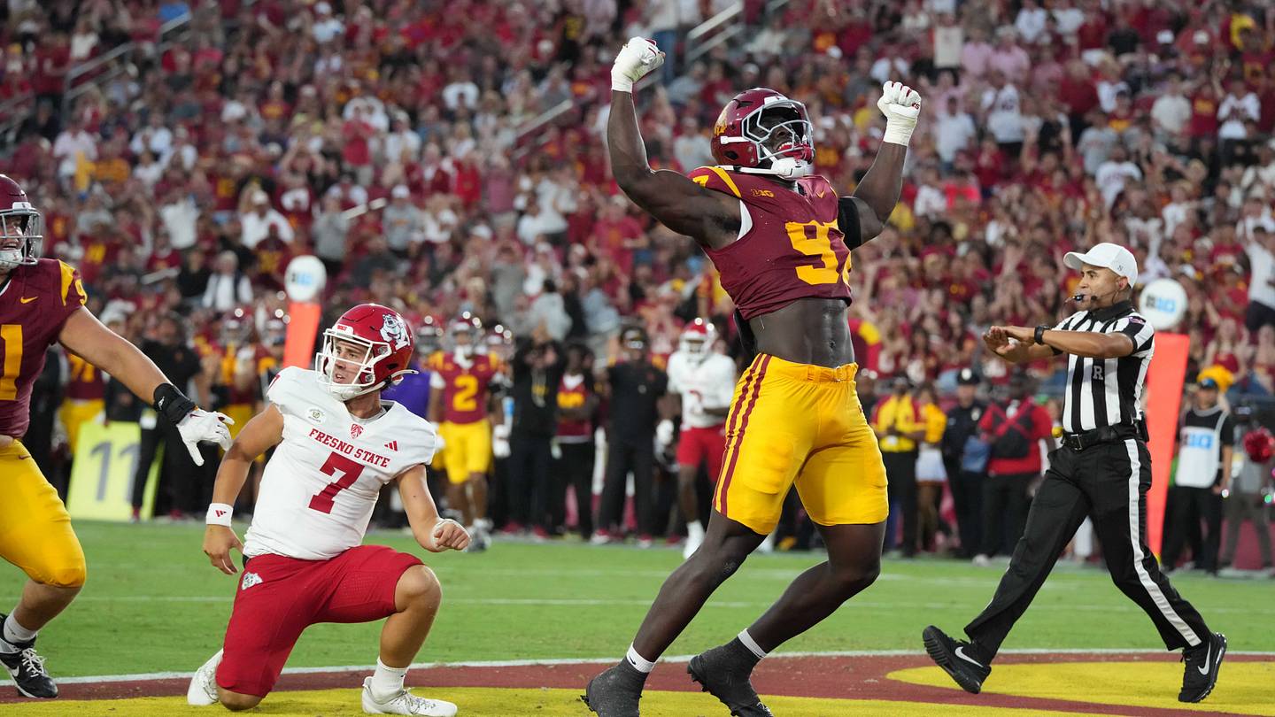 Sep 4, 2026; Los Angeles, California, USA; Southern California Trojans defensive tackle Jide Abasiri (97) celebrates after an incomplete pass by Fresno State Bulldogs quarterback Jayden Mandal (7) in the first half at United Airlines Field at Los Angeles Memorial Coliseum. Mandatory Credit: Kirby Lee-Imagn Images