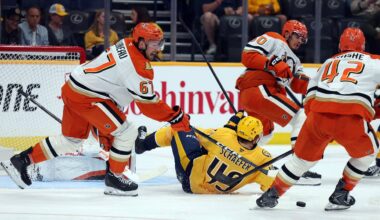 Apr 16, 2026; Nashville, Tennessee, USA; Anaheim Ducks defenseman Tristan Luneau (67) and center Tim Washe (42) defend against an attack by Nashville Predators left wing Reid Schaefer (49) during the second period of their game at Bridgestone Arena. Mandatory Credit: Alan Poizner-Imagn Images