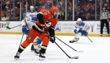 Mar 8, 2026; Anaheim, California, USA;  Anaheim Ducks left wing Chris Kreider (20) skates with the puck past St. Louis Blues right wing Alexey Toropchenko (13) during the second period at Honda Center. Mandatory Credit: Kiyoshi Mio-Imagn Images