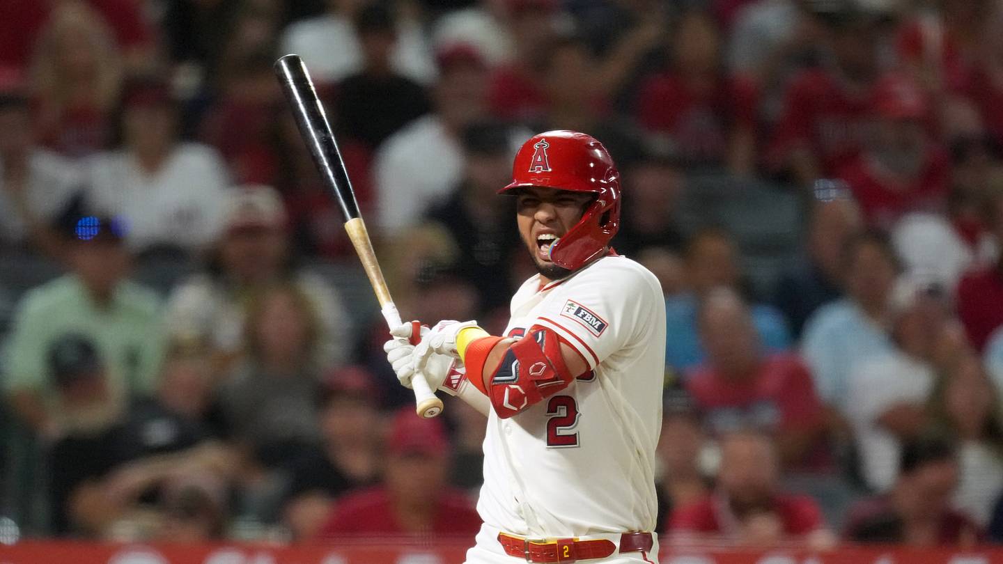 Aug 12, 2026; Anaheim, California, USA; Los Angeles Angels Oswald Peraza (2) reacts after being hit by a pitch in the sixth inning against the Texas Rangers at Angel Stadium. Mandatory Credit: Kirby Lee-Imagn Images