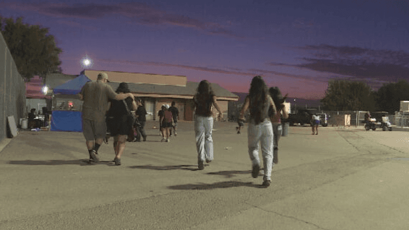Fans flee after gunshots rang out during Independence High School's football game on Friday, August 21, in Bakersfield, CA. PHOTO: KBAK/KBFX