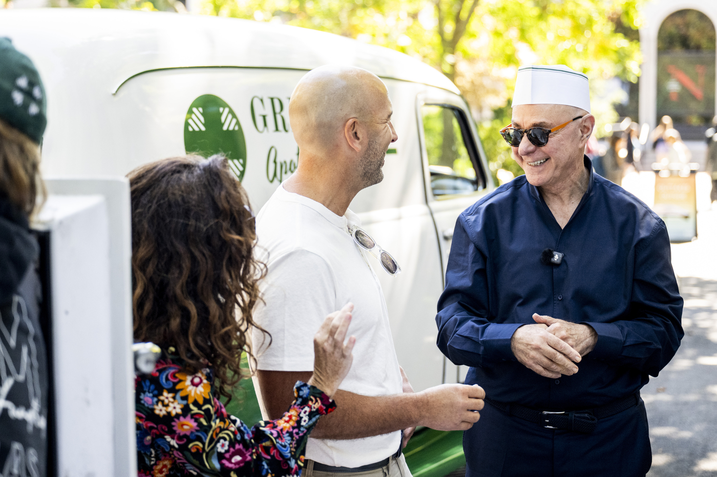 President Joseph E. Aoun talks with Ken and Christina Procaccianti, owners of Green Line Apothecary, near their ice cream truck.