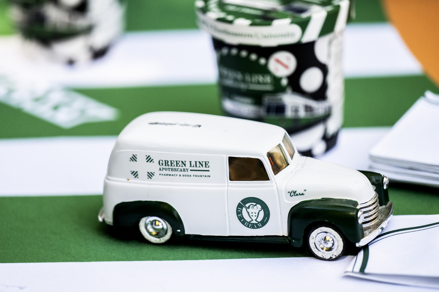 Close-up detail of the green and white Green Line Apothecary ice cream truck.